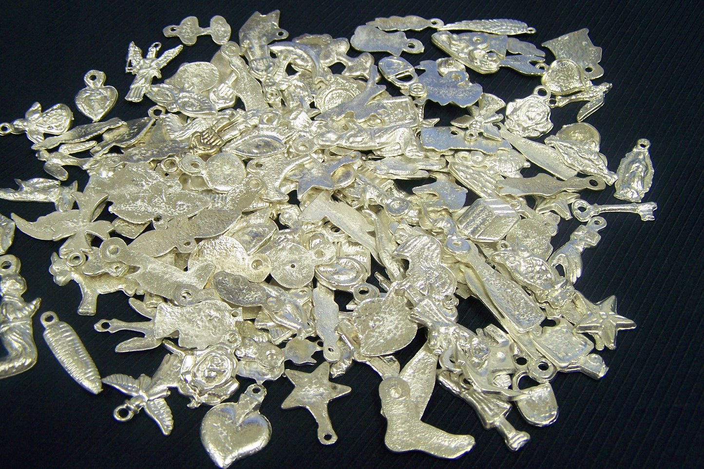 Lot of 50 All Different Shiny Silver-Colored Milagros, Mexico