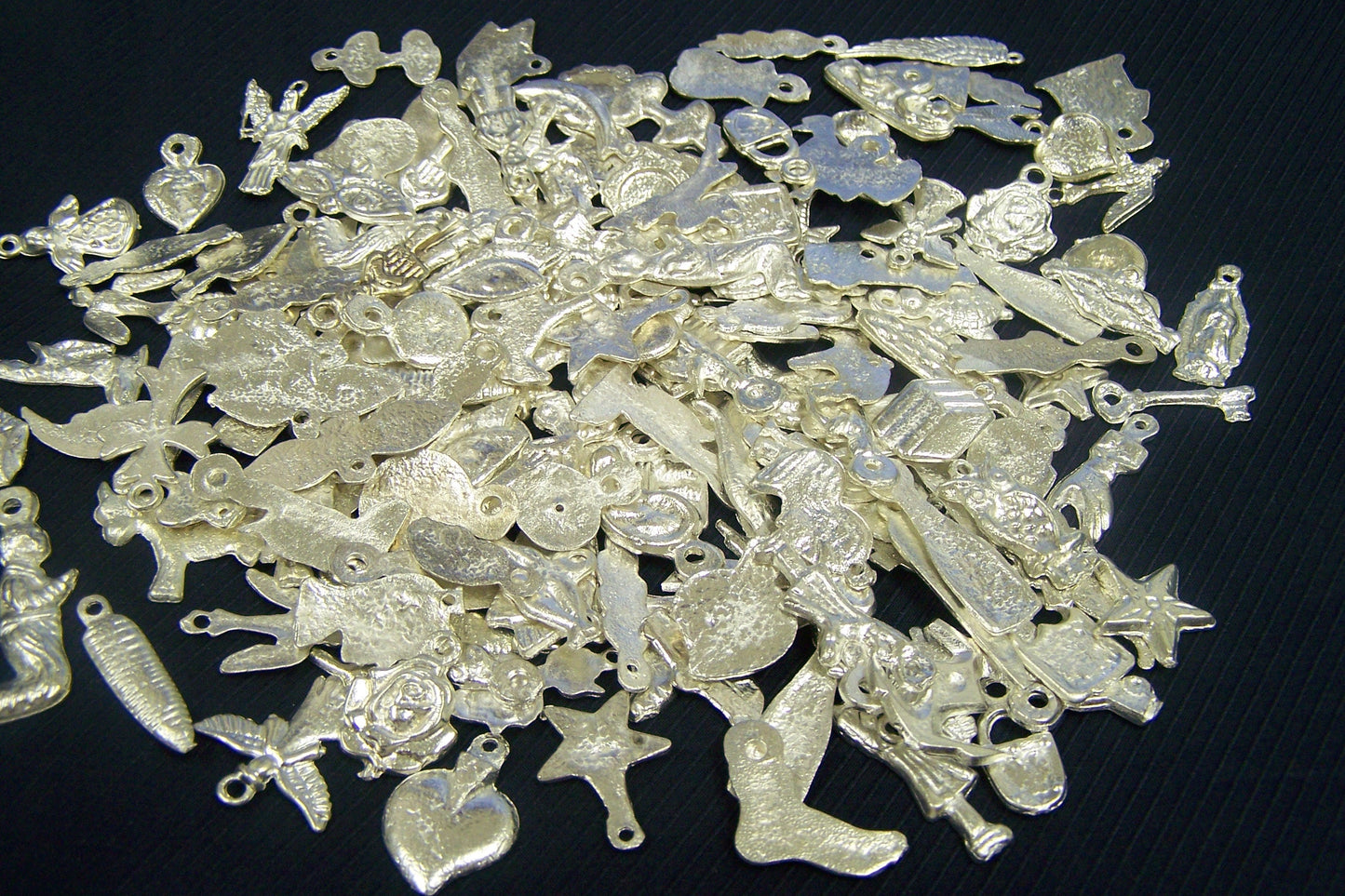 Lot of 100 Assorted Shiny Silver-Colored Milagros, Mexico